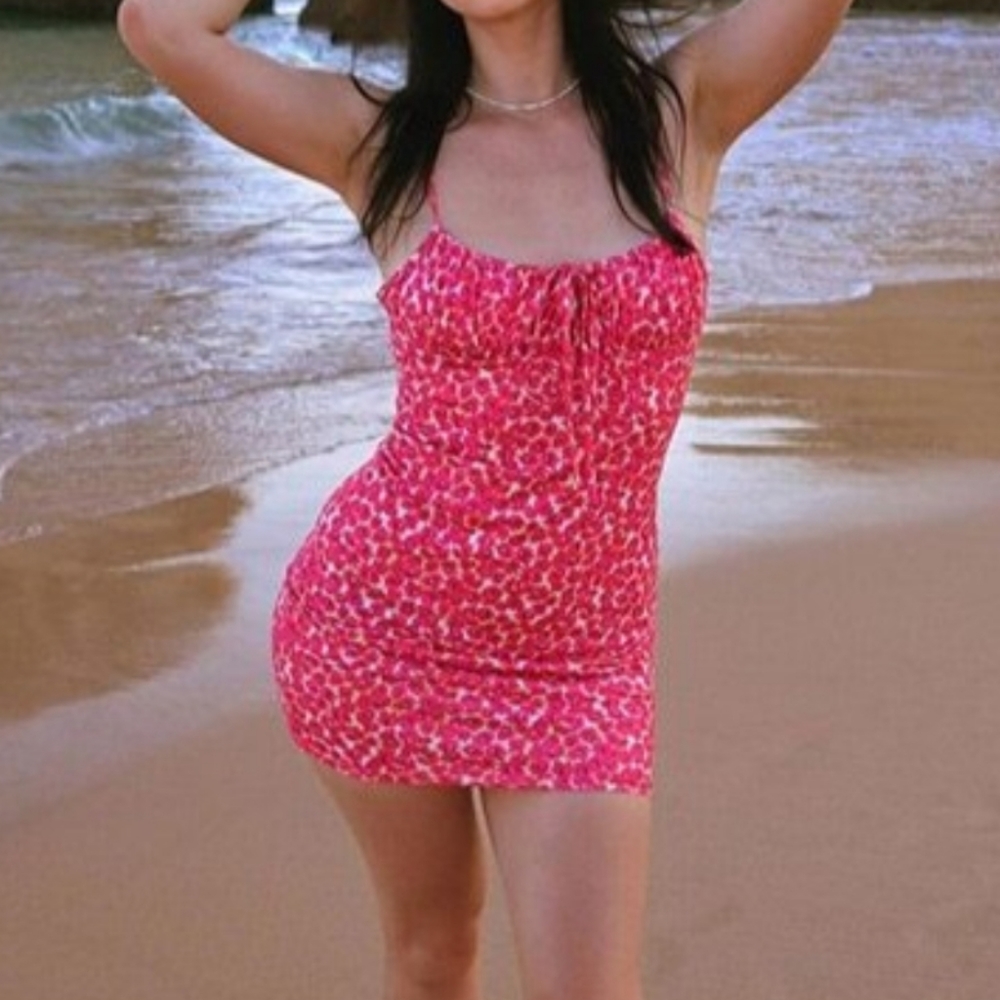 Women's sexy bodycon ruched neckline knotted short beach dress.